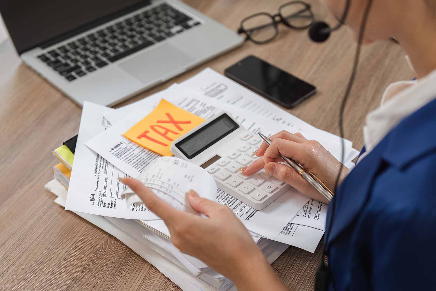A tax preparer reviewing tax documents for a client