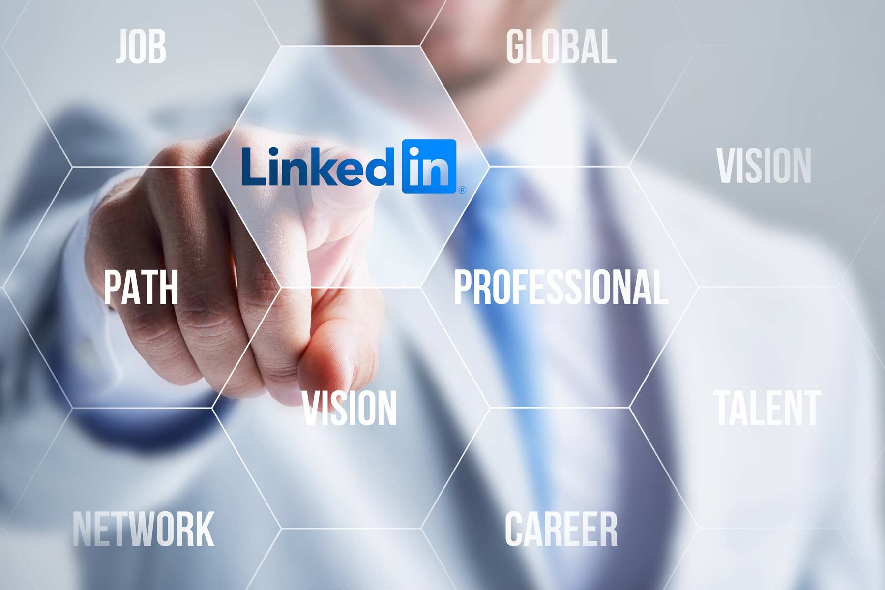 Business professional pointing at LinkedIn logo on virtual career and network screen Business professional pointing at LinkedIn logo on virtual career and network screen